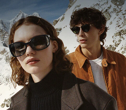 Couple wearing designer sunglasses