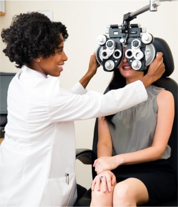 Patient getting an eye exam at Vogue Vision