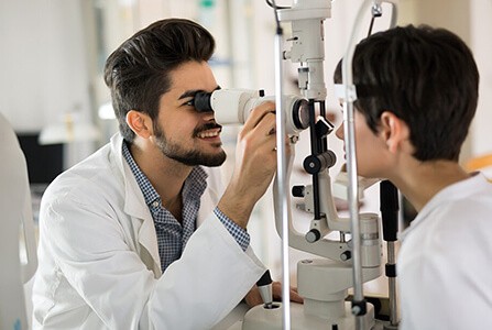 Woman getting an eye exam for glasses fitting