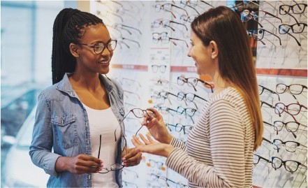 Woman talking about eyewear selection at Vogue Vision